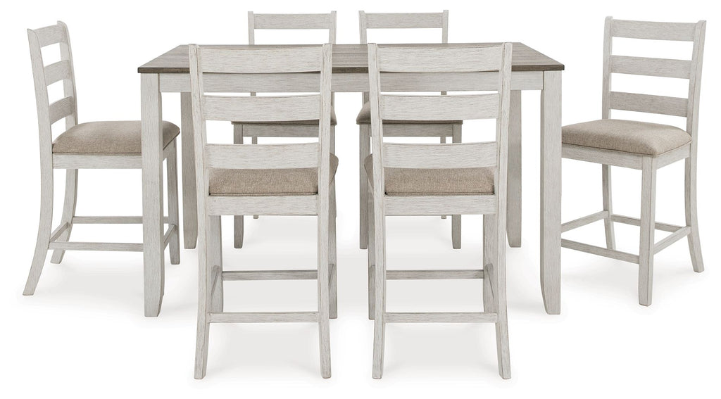 White counter-height dining table with light brown top and six bar stools with beige seats