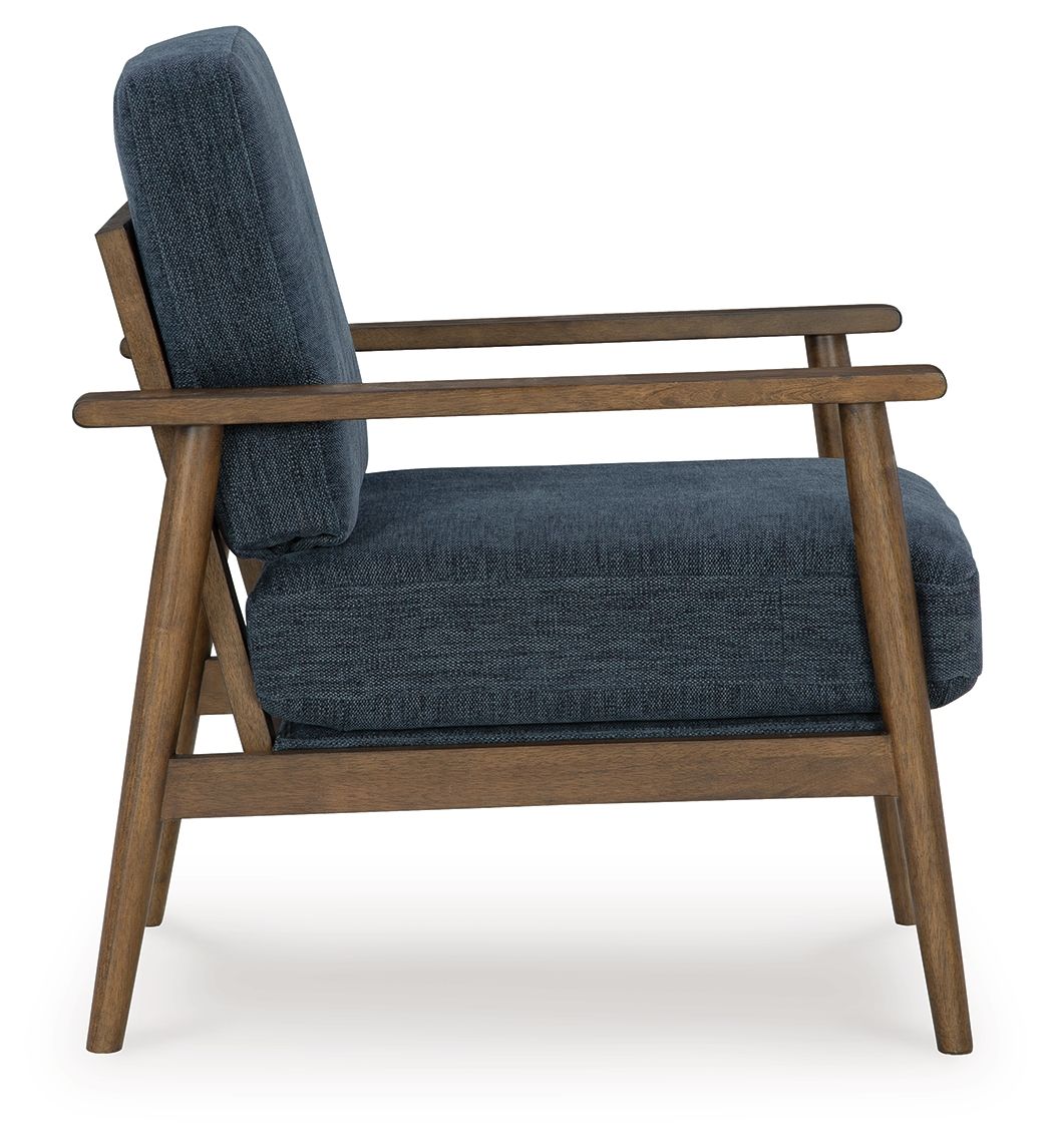 Blue accent chair angled view with tall back and upholstered seat cushion