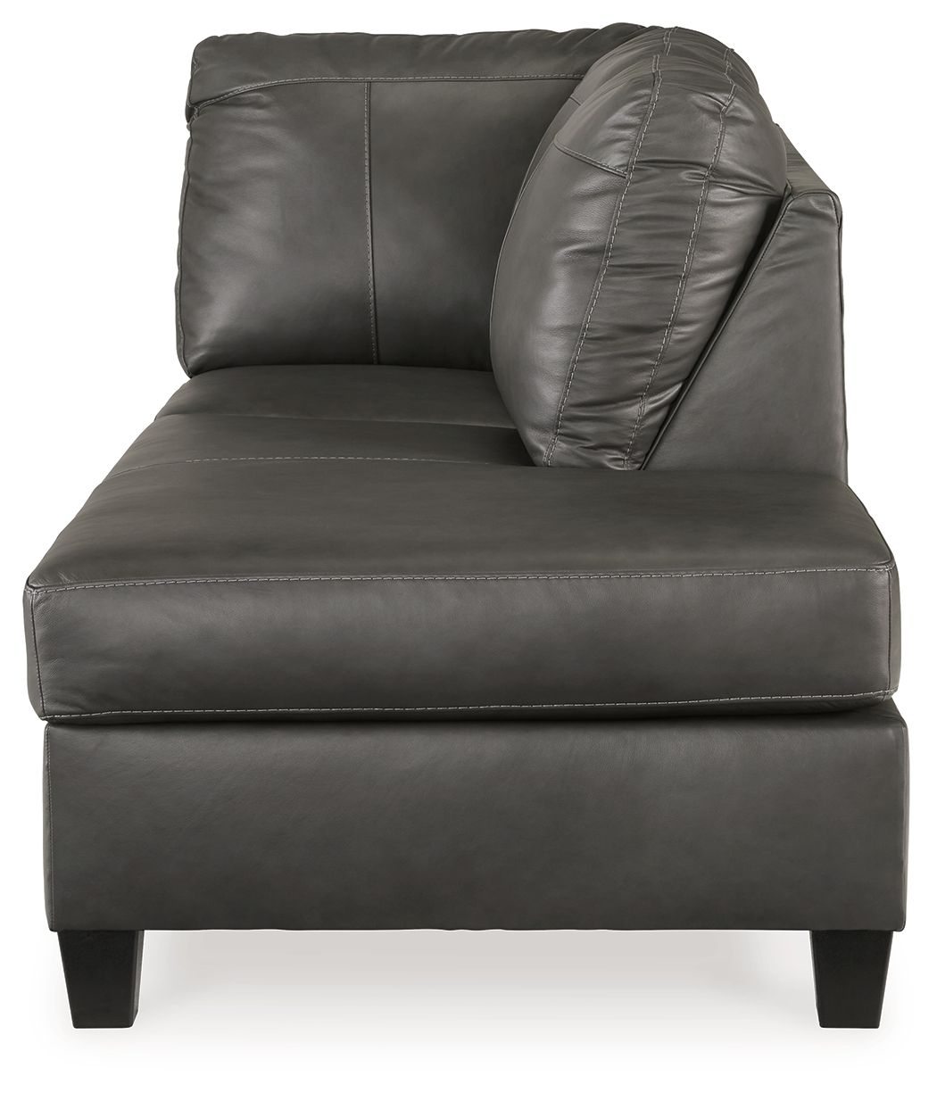 Fog gray leather corner chaise with padded backrest, rounded arm, and square feet.