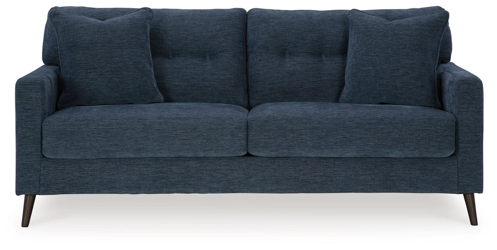 Navy blue fabric sofa with split seat cushions and four back pillows