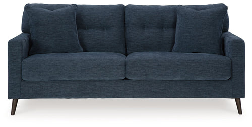 Navy blue fabric sofa with split seat cushions and four back pillows