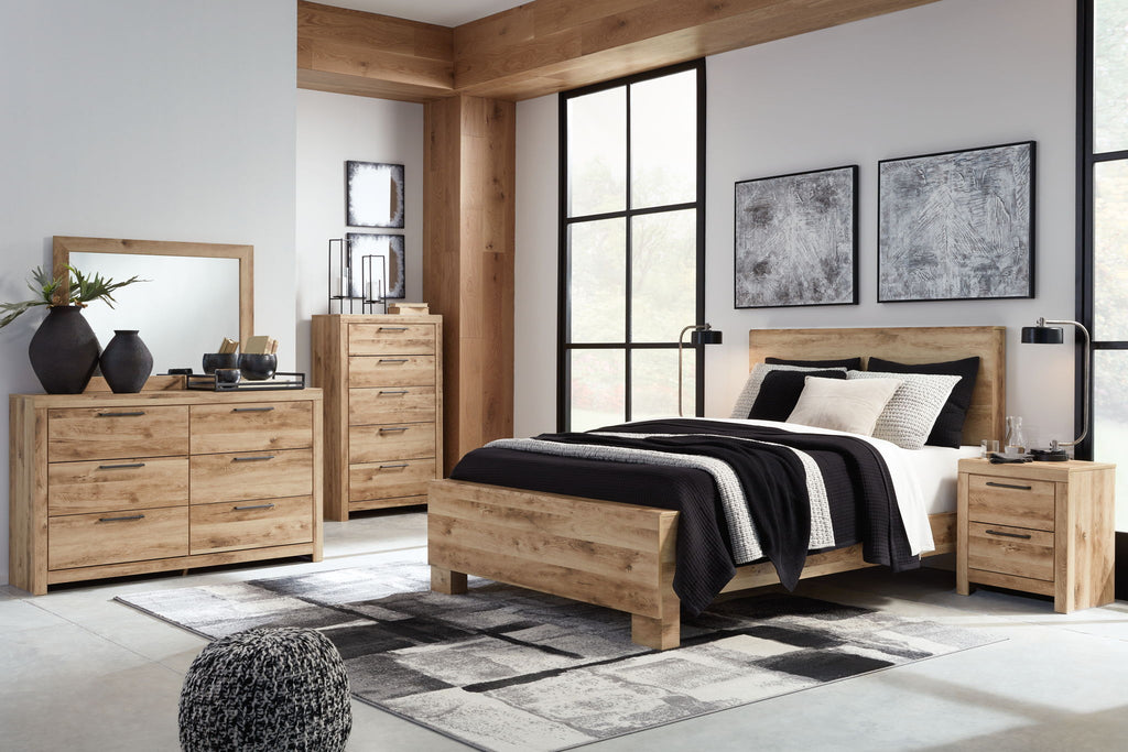 Light beige wood panel bedroom set with bed, dresser, mirror, and matching nightstands