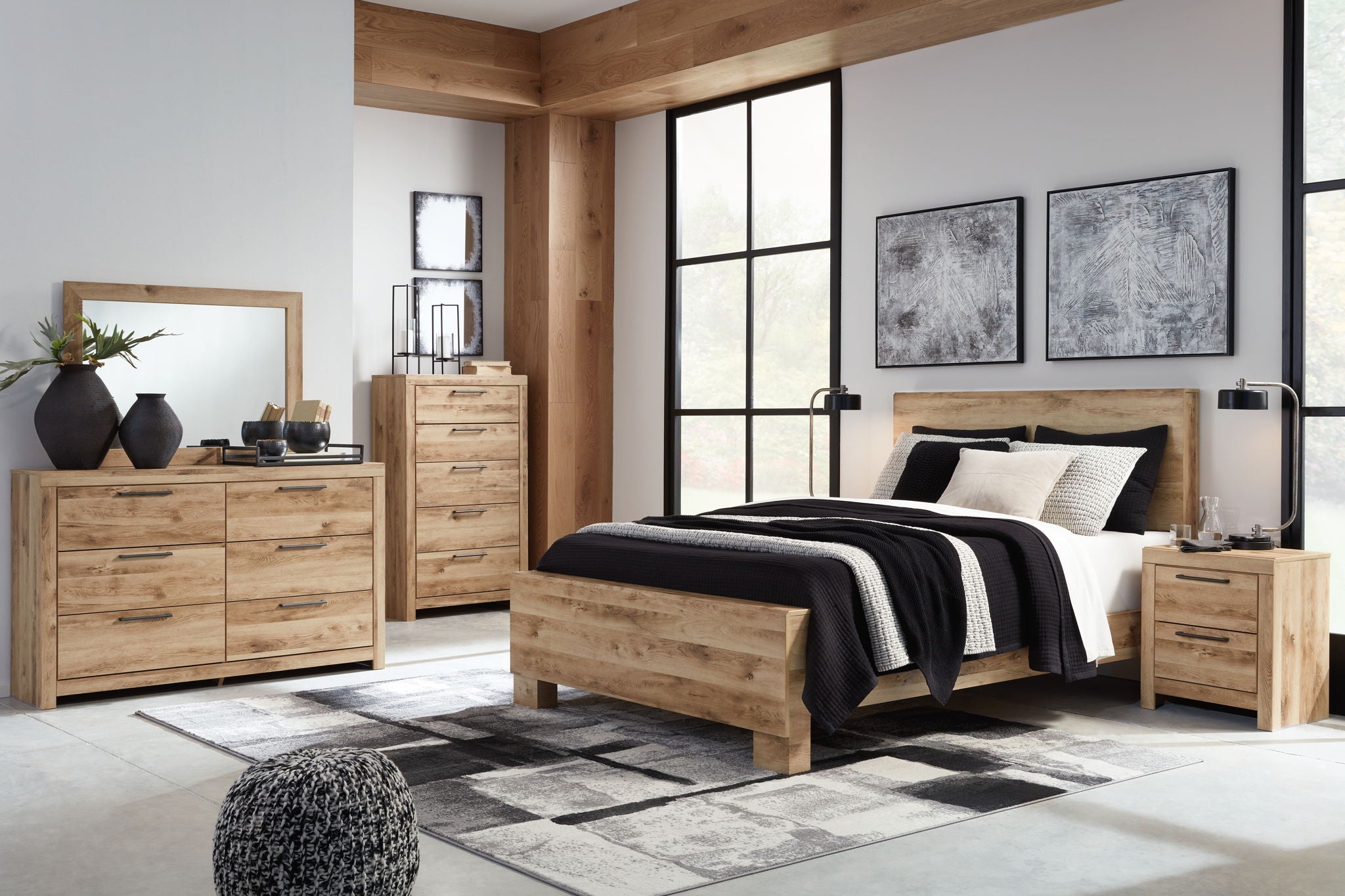 Light beige wood panel bedroom set with bed, dresser, mirror, and matching nightstands