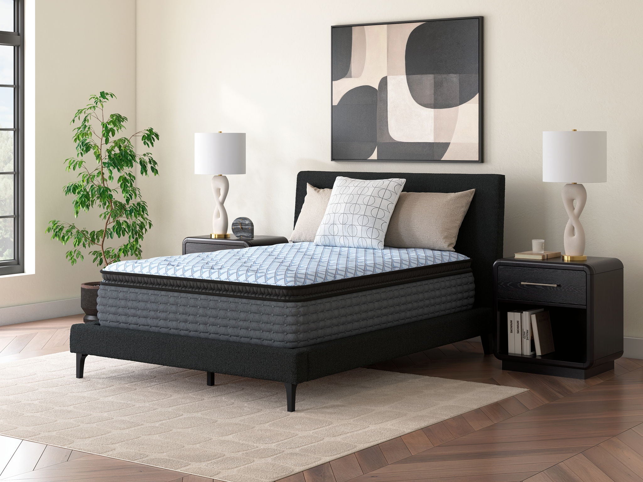 Blue quilted mattress on a dark bed frame with side panels visible