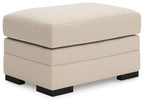 Light beige jute-look rectangular ottoman with tufted top and black block legs