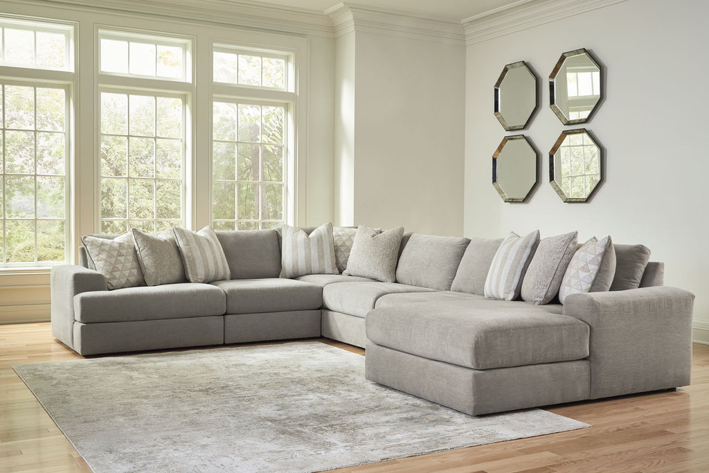 Gray sectional sofa set with chaise corner and striped throw pillows