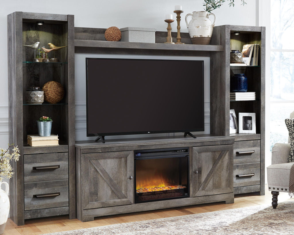 Gray entertainment center with TV opening, storage drawers, and lit faux fireplace insert