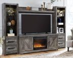 Gray entertainment center with TV opening, storage drawers, and lit faux fireplace insert
