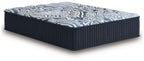 Blue upholstered mattress with navy ribbed sides and patterned top in blue