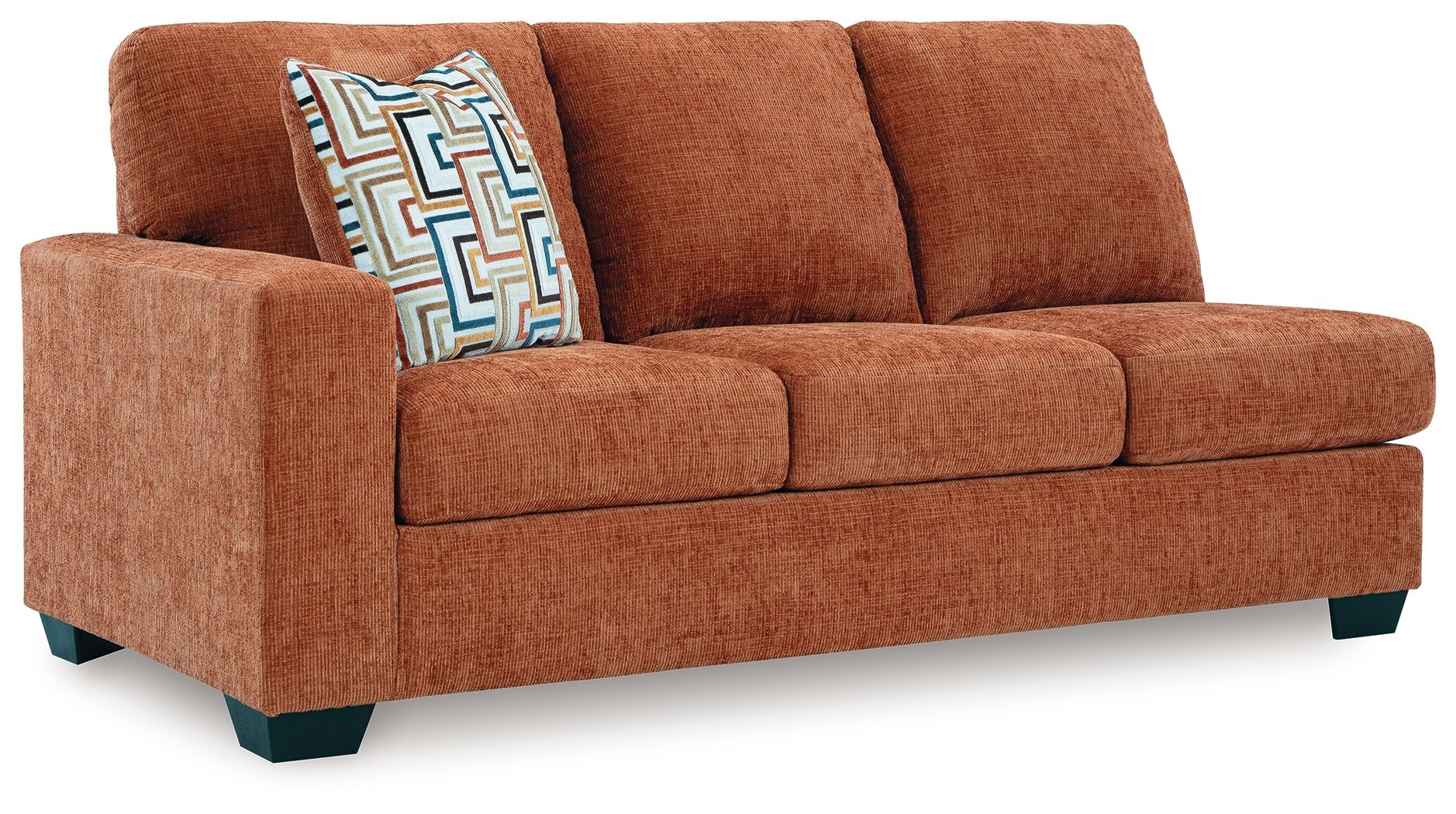 Brown fabric sofa with three seat cushions and patterned accent throw pillow
