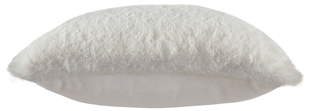 White faux fur pillow with smooth light backing visible at the edge.