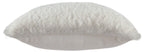 White faux fur pillow with smooth light backing visible at the edge.