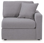 Heather gray upholstered corner chair, corner-facing view with back and arm cushions