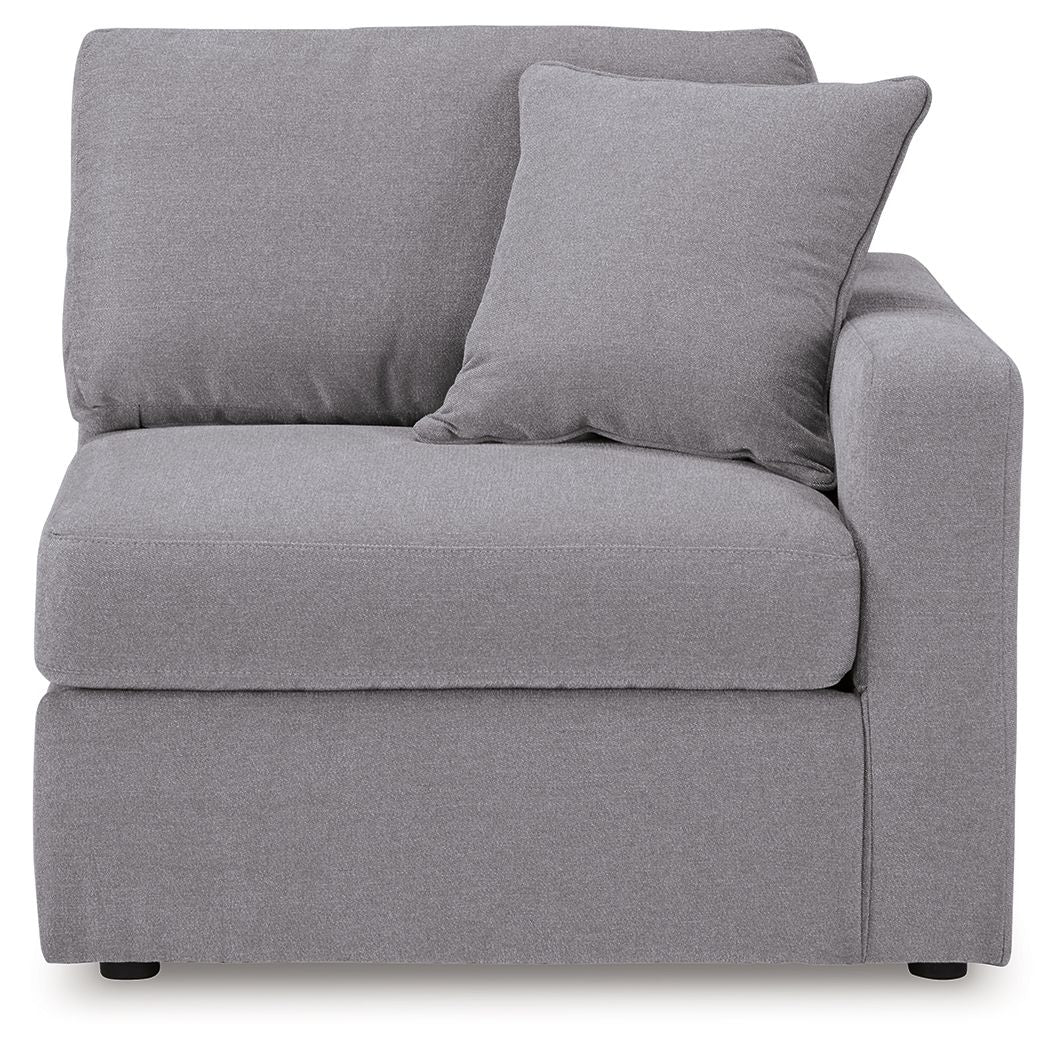 Heather gray upholstered corner chair, corner-facing view with back and arm cushions