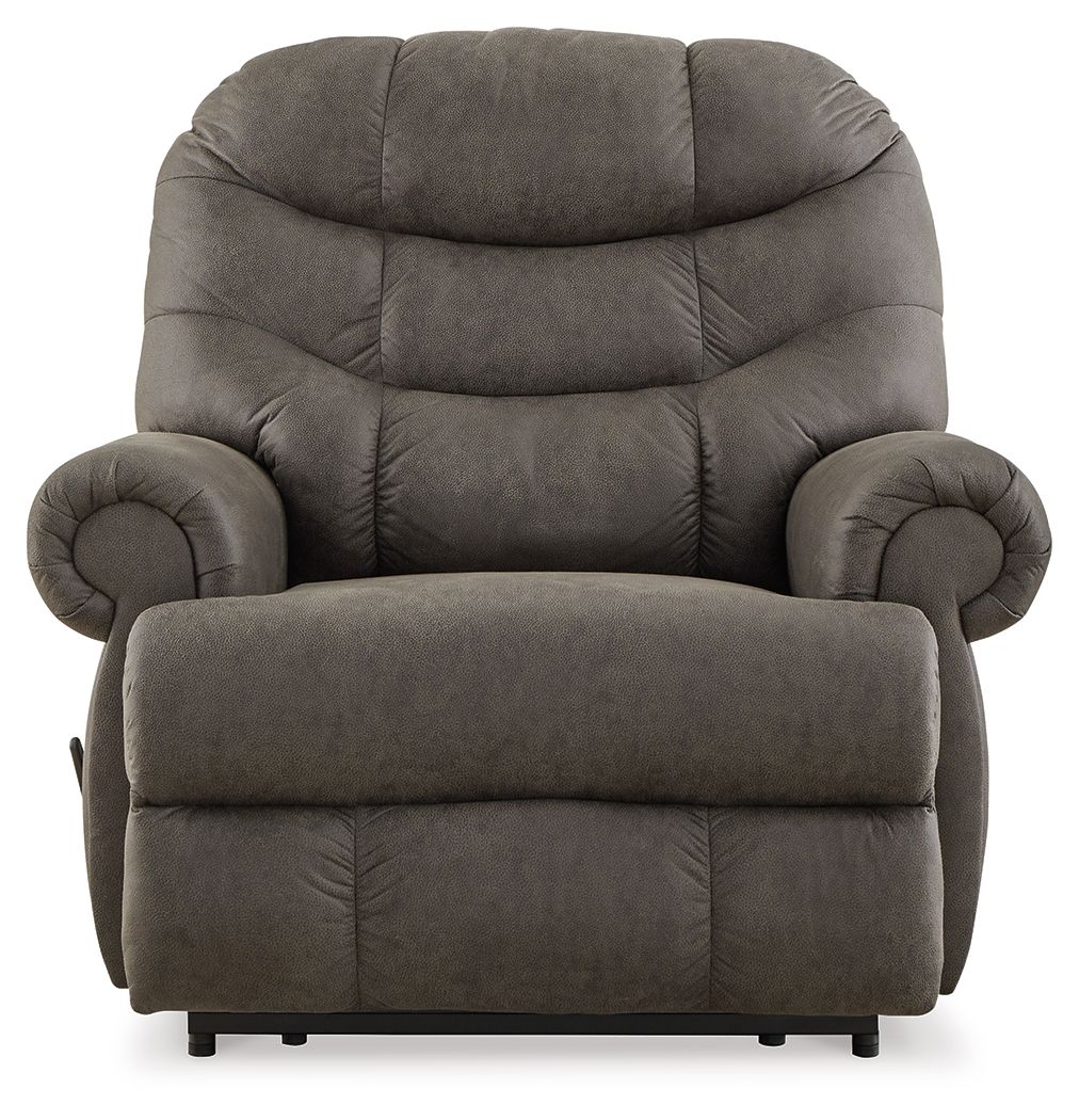 Gunmetal recliner chair with high back, rounded armrests, and padded footrest.