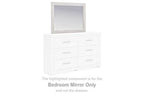 Whitewash bedroom mirror with rectangular frame, shown above a dresser
