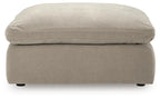 Oversized accent ottoman in light gray, front view with thick cushion and legs