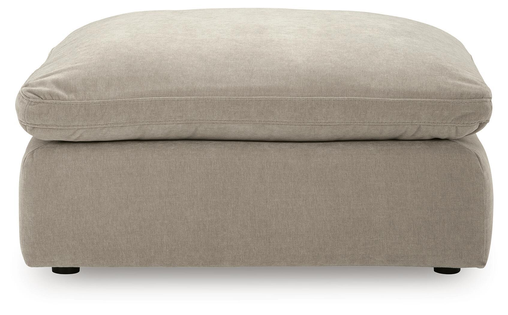 Oversized accent ottoman in light gray, front view with thick cushion and legs