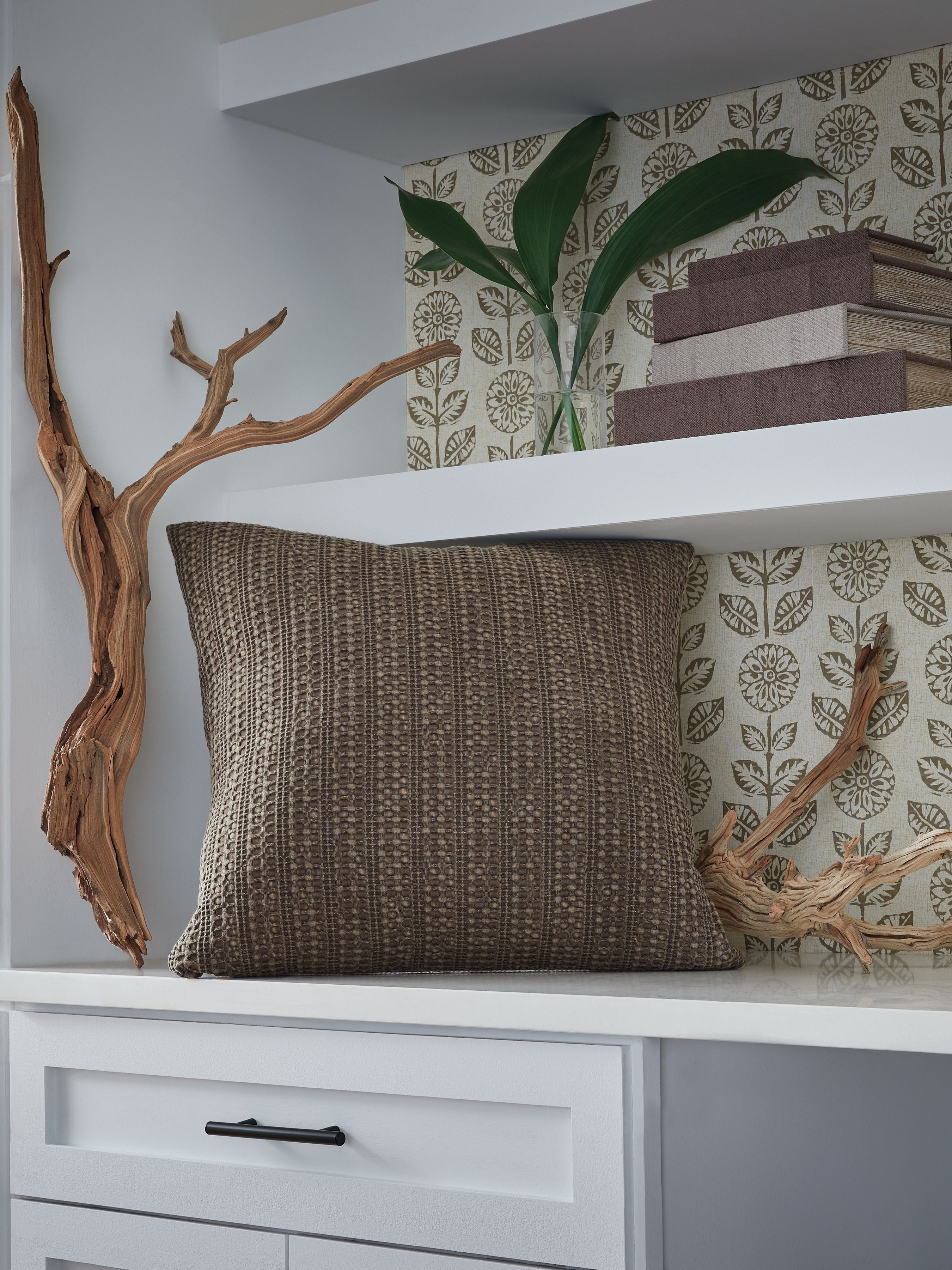 Dark brown textured throw pillow with vertical woven stripe pattern