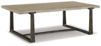 Gray rectangular cocktail table with slanted dark metal base and squared legs