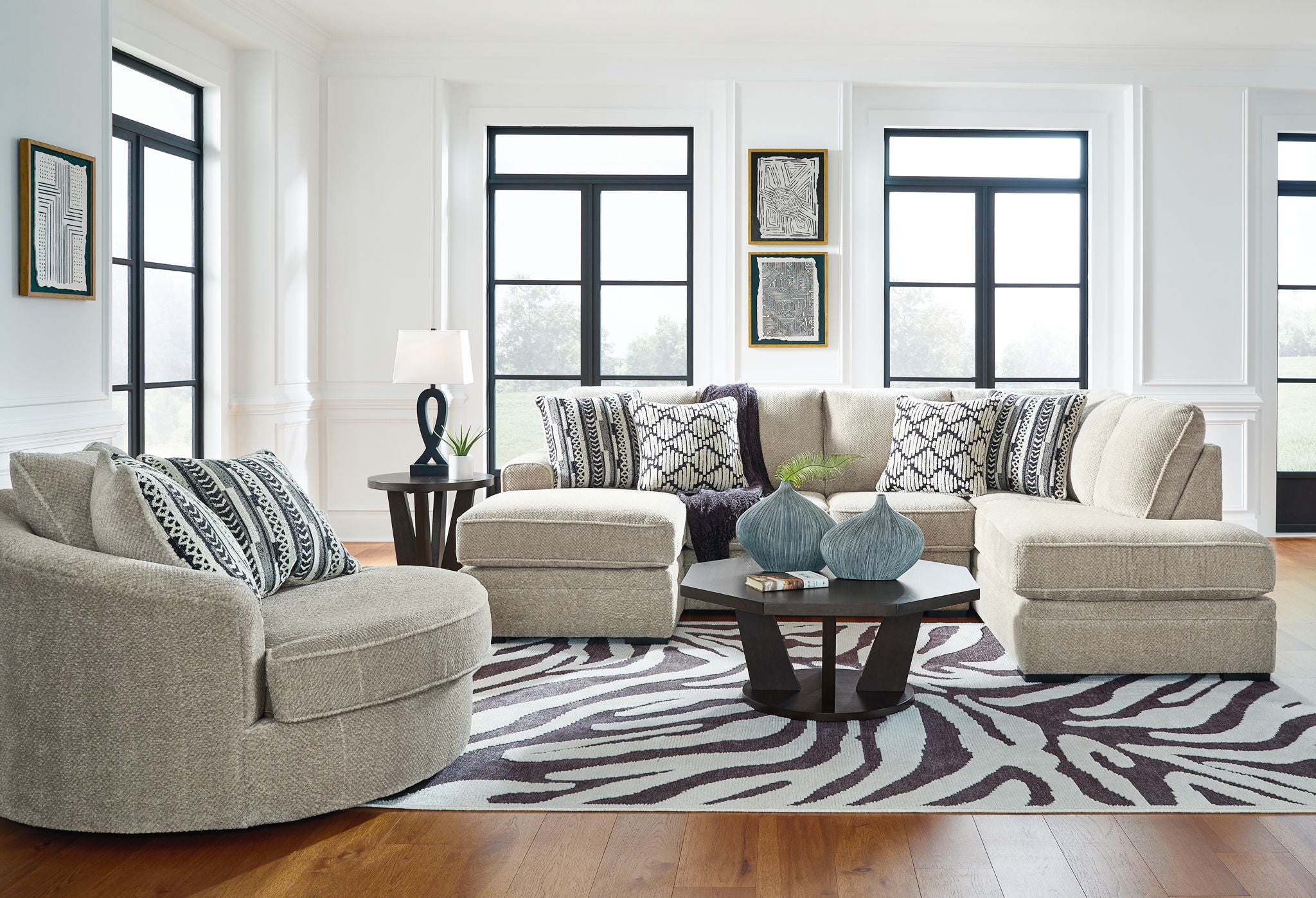 Beige sectional corner chaise sofa with patterned pillows and multiple matching chaise seats