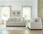 Light gray sofa and chair set with four throw pillows and dark block feet
