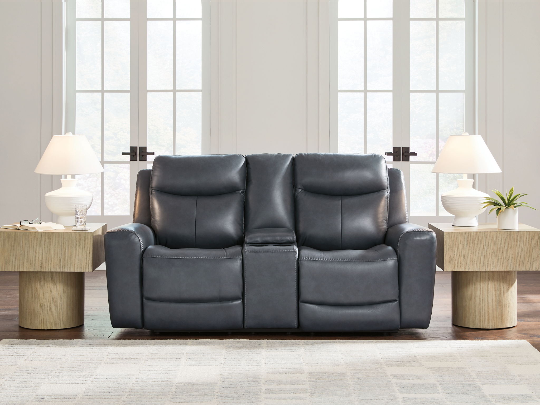 Blue power reclining loveseat with console and adjustable headrests