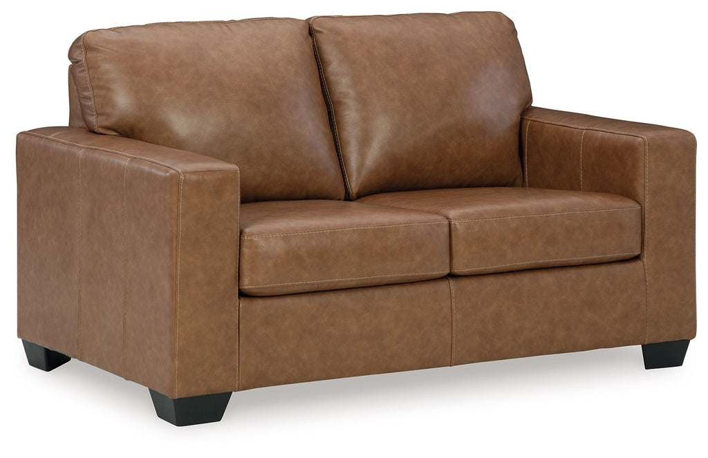 Light brown loveseat sofa with tufted back cushions, armrests, and dark square feet