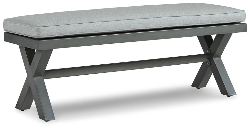 Gray outdoor bench with rectangular cushion and dark gray legs