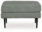 Charcoal upholstered ottoman with visible seam line and tapered black legs