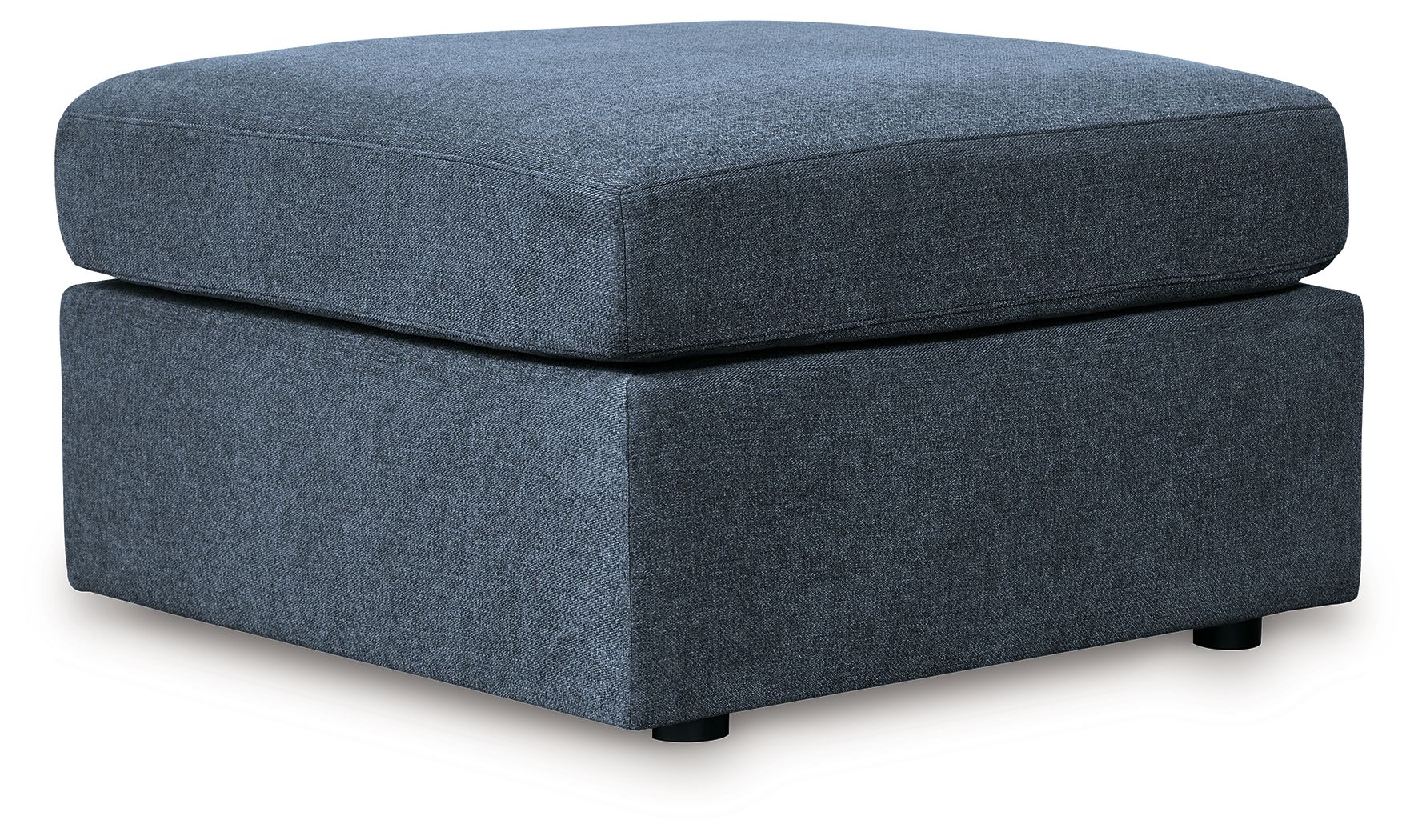 Blue accent ottoman with cushioned top and square base, dark feet.