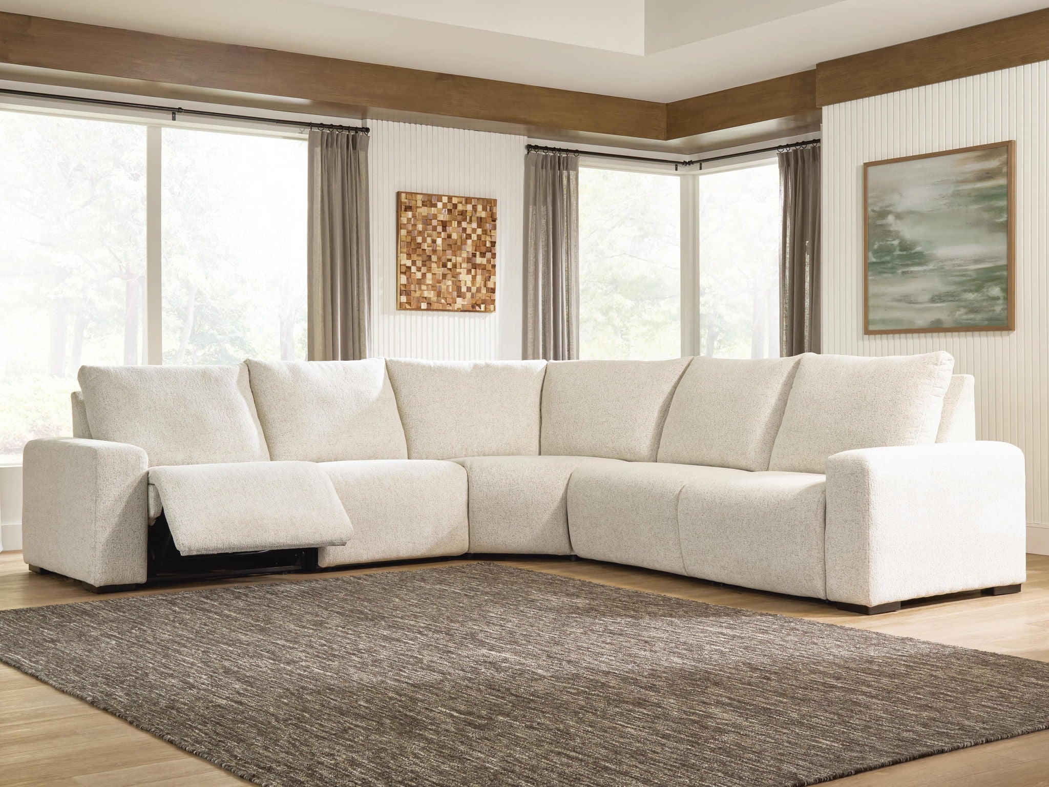 White power reclining sectional sofa with L-shaped layout and wide cushioned back