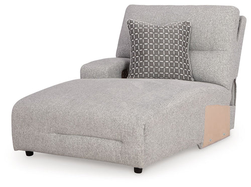 Pewter gray upholstered chaise with tall back, padded arm, and grid accent pillow