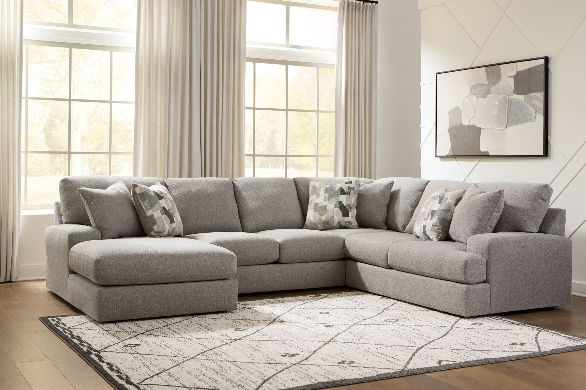 Lindon corner sectional sofa in smoke gray with deep cushions and patterned pillows