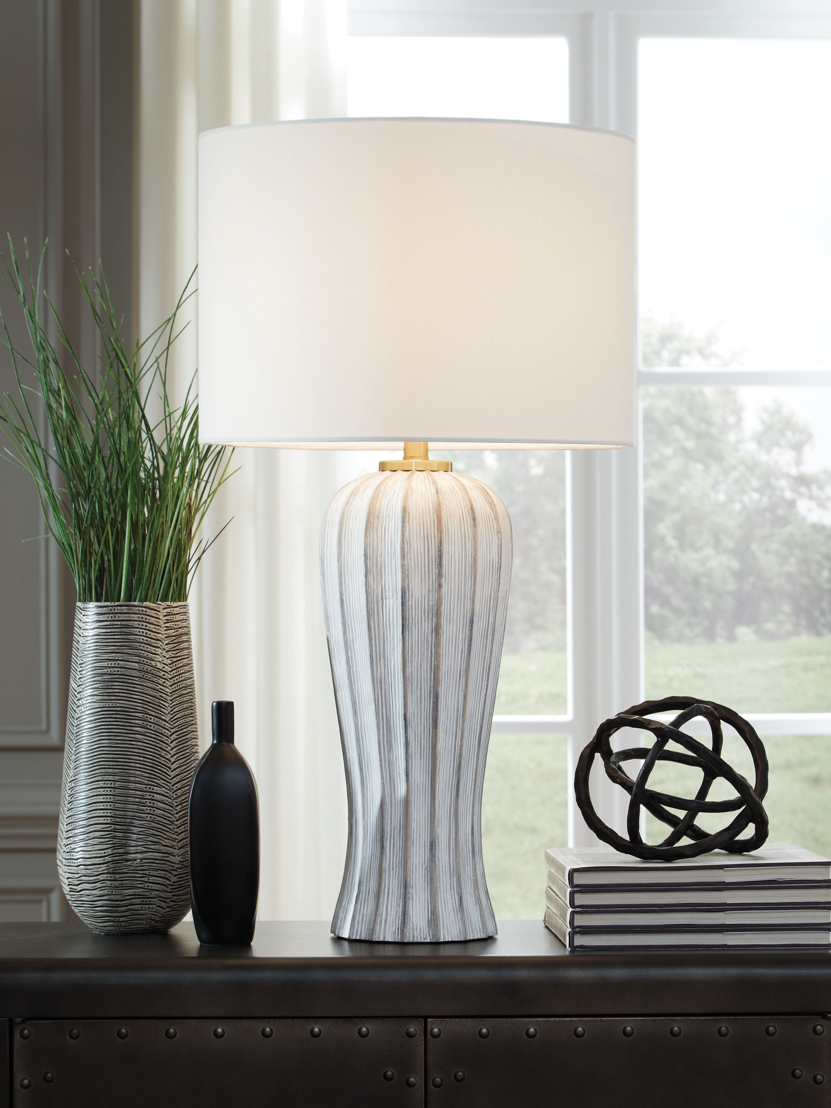 Poly table lamp featuring white drum shade and tall striped antique gray body