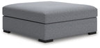 Oversized accent ottoman with rounded top in dark gray speckled fabric, low legs