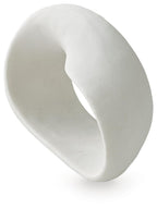 White abstract sculpture, side view with oval center hole and rounded edges.