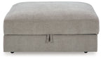 Pebble gray storage ottoman front view with hinged lid and pull tab