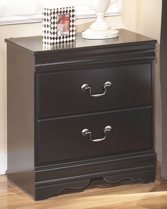 Two-drawer nightstand with dark finish, arched handles, and scalloped base