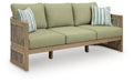 Beige sofa with green seat cushions and striped throw pillows