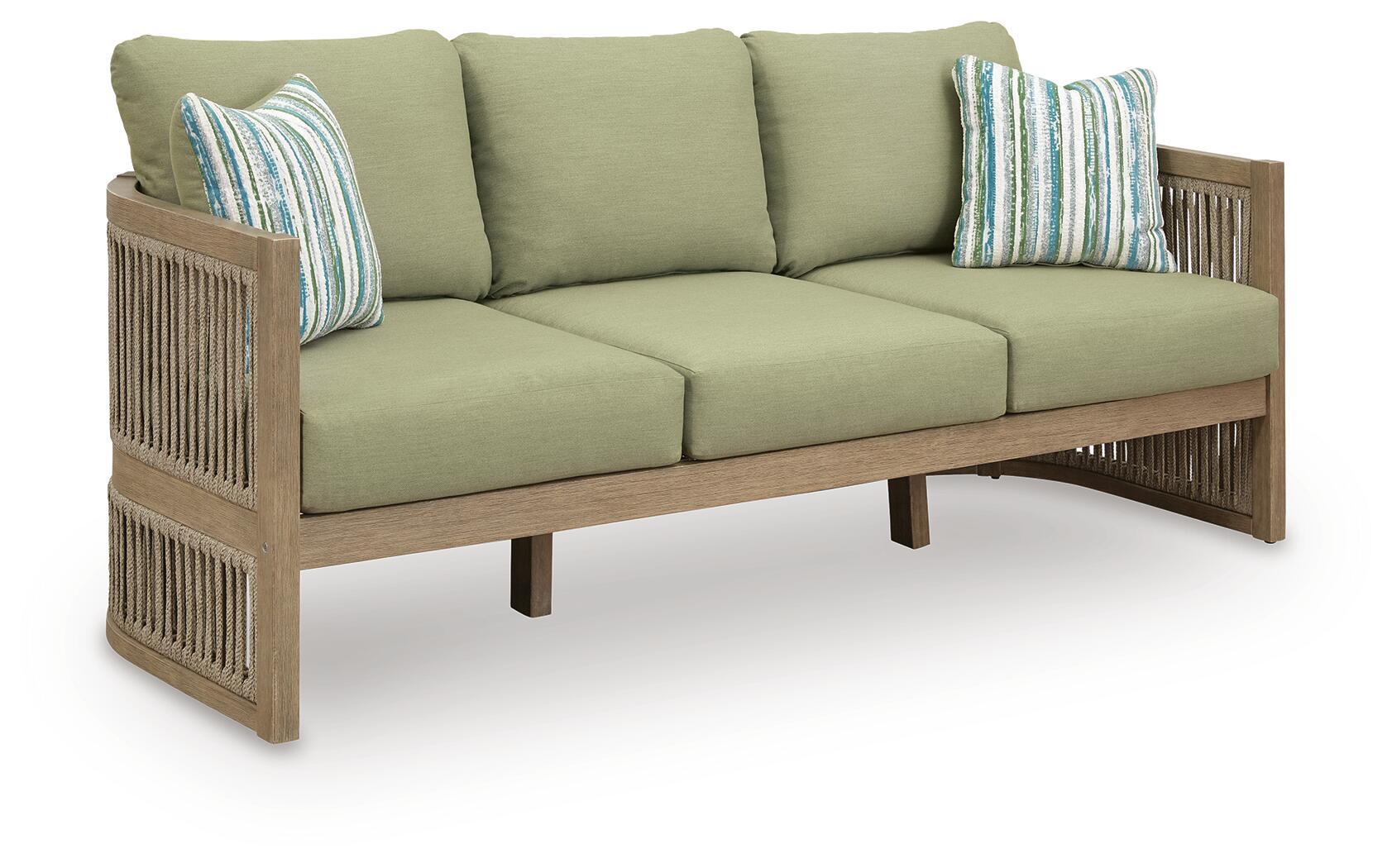 Beige sofa with green seat cushions and striped throw pillows