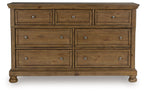 Feddinger medium brown wooden dresser with six drawers and metal knobs