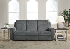 Power reclining sofa, gravel gray upholstery with three back cushions and wide arms