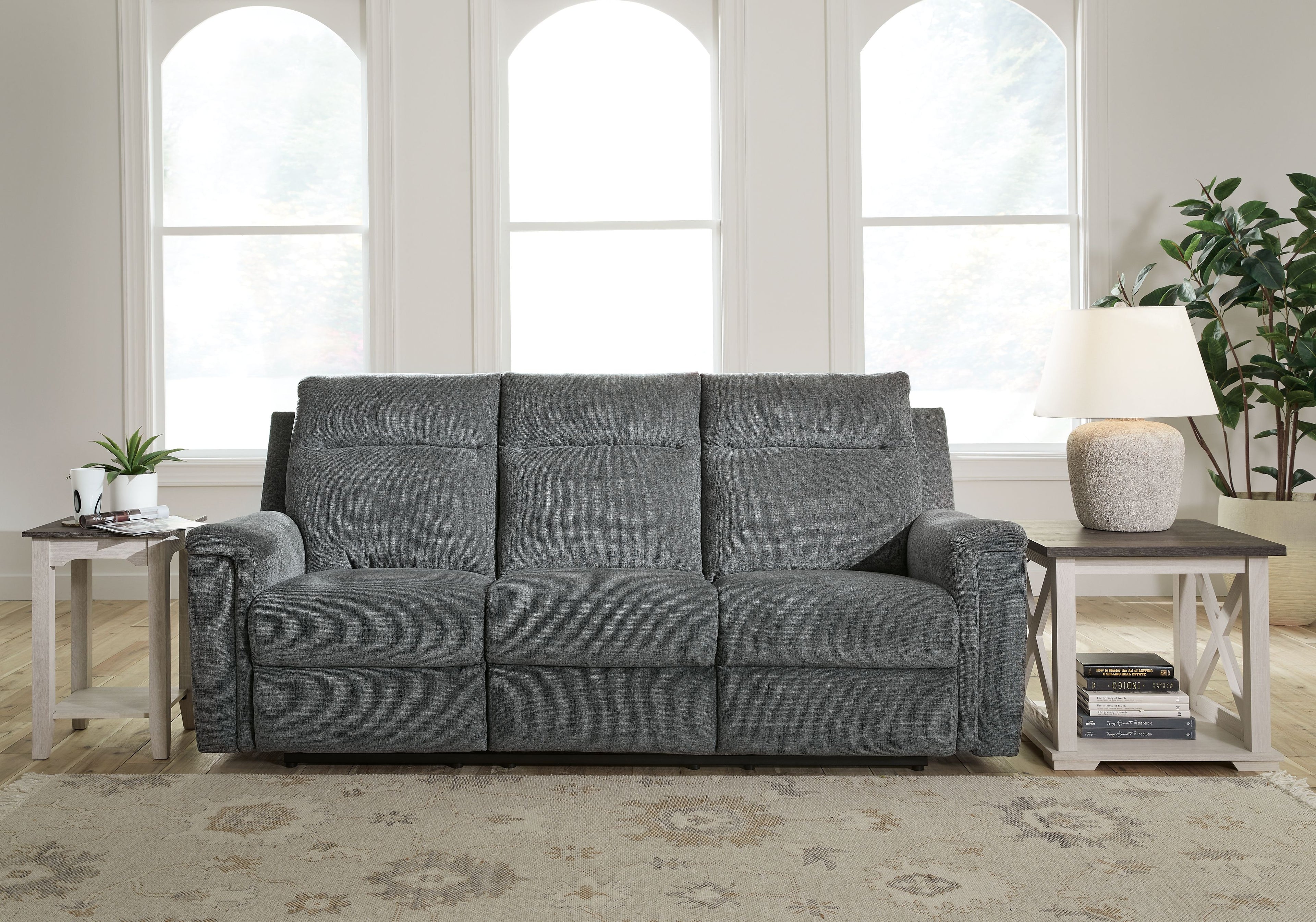 Power reclining sofa, gravel gray upholstery with three back cushions and wide arms
