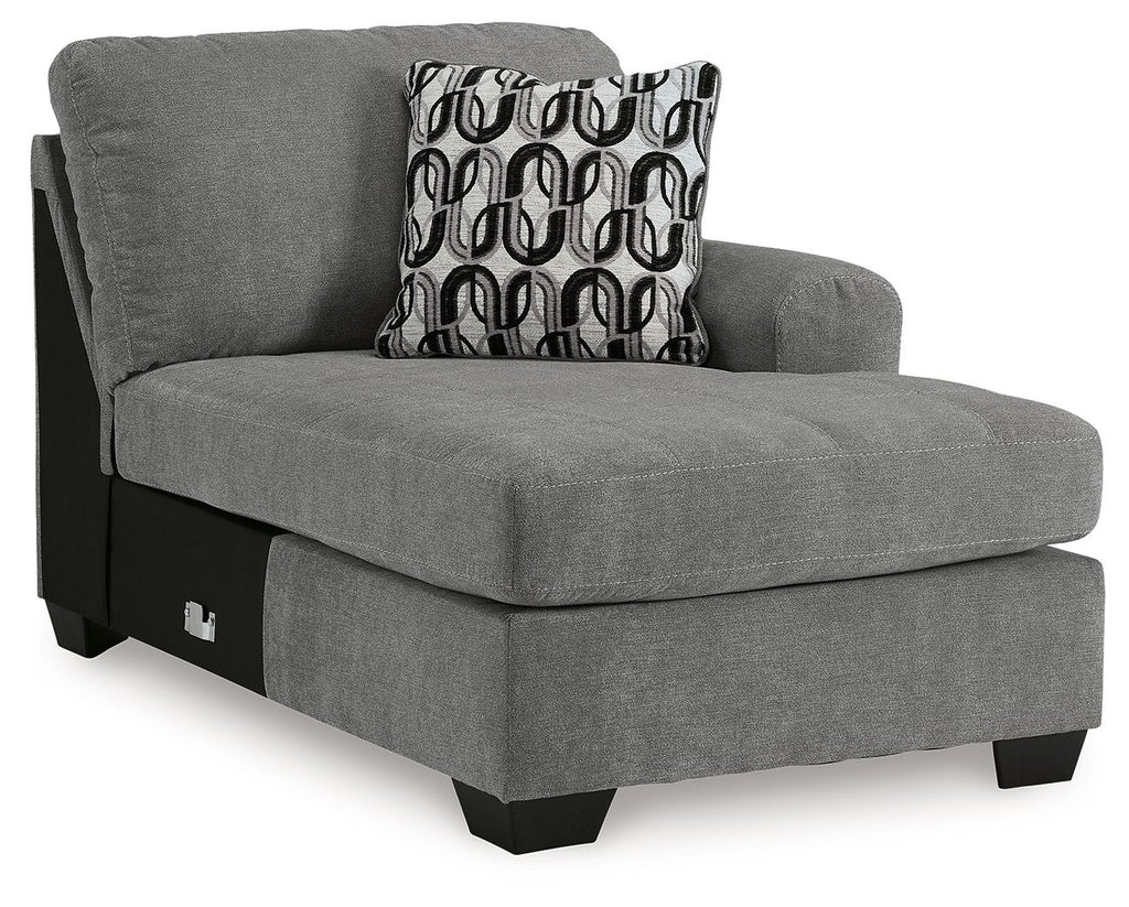 Gray upholstered corner chaise with patterned back cushion