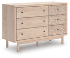 Wood dresser with three drawers and floral-pattern cabinet fronts, dark knobs