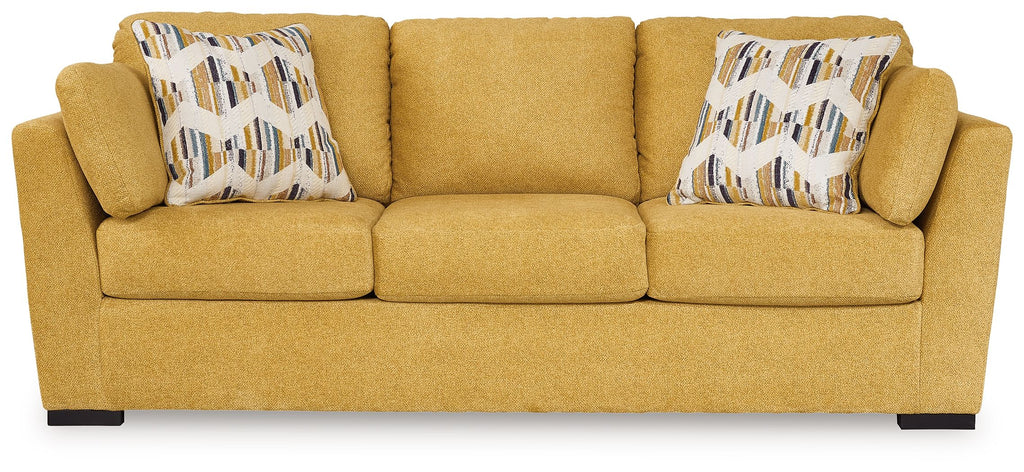 Sunflower sofa sleeper with three-seat cushions and two patterned throw pillows