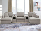 Gray sectional sofa with chaise seating and dark audio console panels at both side ends