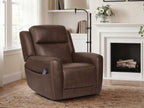 Dark brown power lift recliner with plush arms and back, shown in a home interior