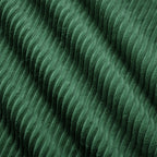 Green corduroy fabric close-up with dense ridged texture